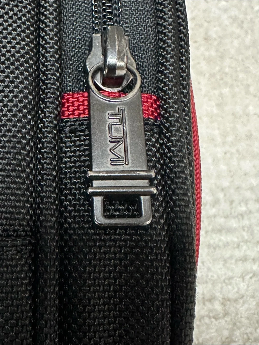 Tumi Black Toiletry Bag with Red Accents